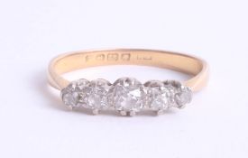 An 18ct diamond five stone ring, size R.