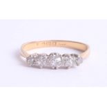 An 18ct diamond five stone ring, size R.