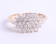 An 18ct diamond cluster ring, 3.9g, size N.