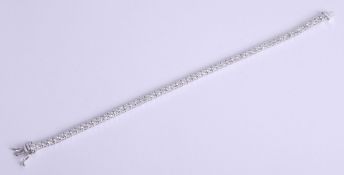A fine 18ct diamond bracelet, length 19cm, set with approximately 5.80ct of bright diamonds, 11.