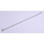 A fine 18ct diamond bracelet, length 19cm, set with approximately 5.80ct of bright diamonds, 11.