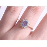 An 18ct sapphire and diamond cluster ring, size N.