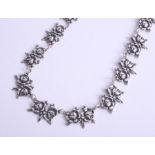 Silver, a pretty flower necklace set with roses, 14.7g.