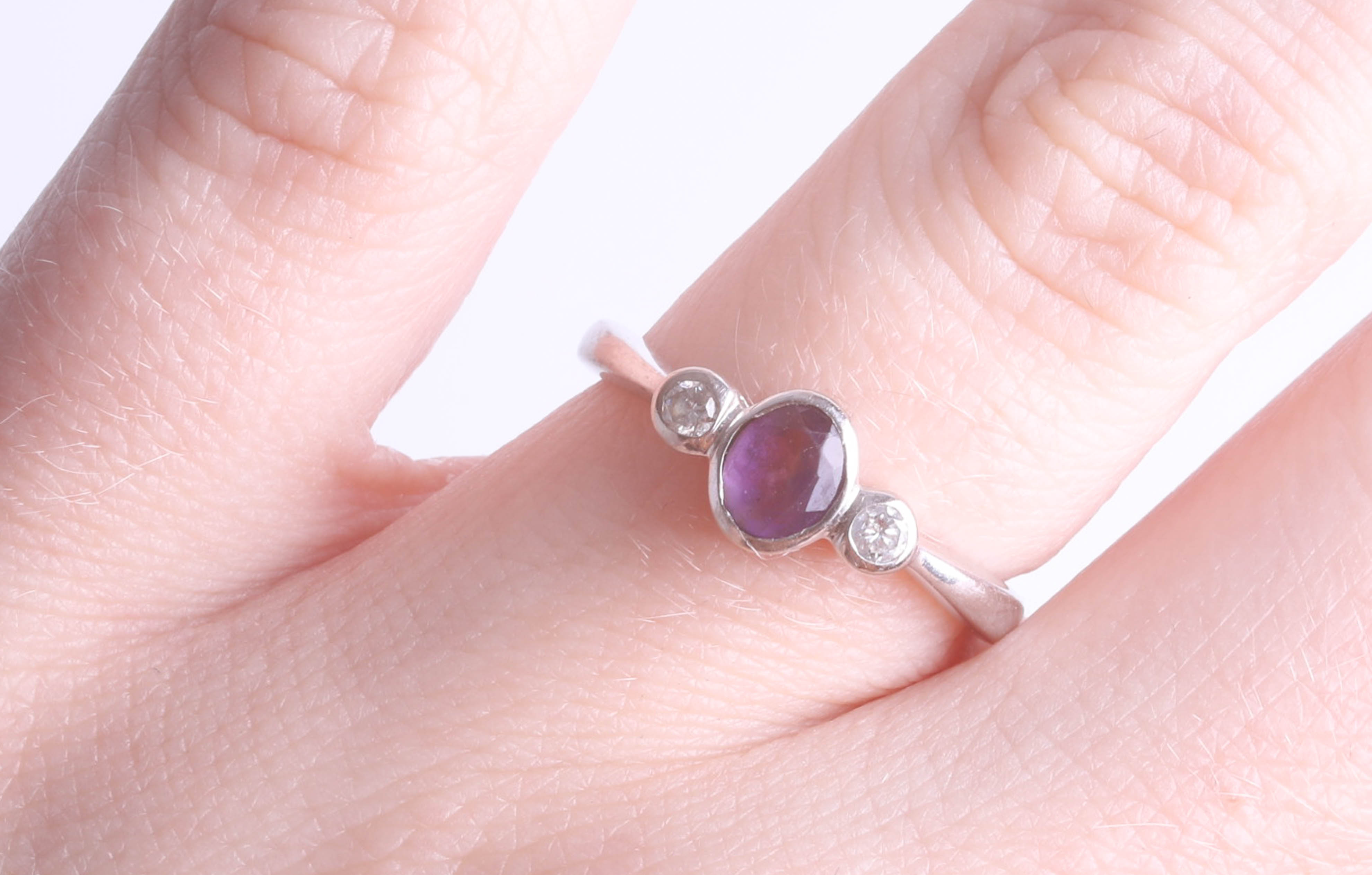 An 18ct white gold amethyst and diamond set three stone ring, size K. - Image 2 of 2