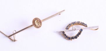 A 9ct gold and citrine set brooch together with an unusual diamond set bar brooch with blue stone