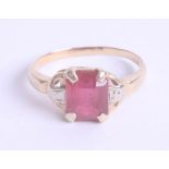 A ruby style and diamond set ring in yellow gold, unmarked, size L.