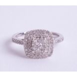 A 9ct white gold and diamond set ring, size L.