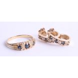 A yellow gold ring set with three sapphires and small diamonds, indistinct mark possibly 18ct,