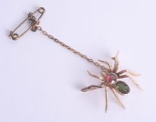 A Victorian tourmaline spider brooch.