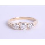 An 18ct diamond trilogy ring approx 1.00ct, estimated colour and clarity D/SI1, Size M.