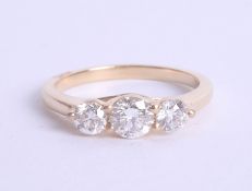 An 18ct diamond trilogy ring approx 1.00ct, estimated colour and clarity D/SI1, Size M.