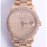 Rolex, a gents gold and diamond Rolex Day Date wristwatch, with round pave set diamond dial, with