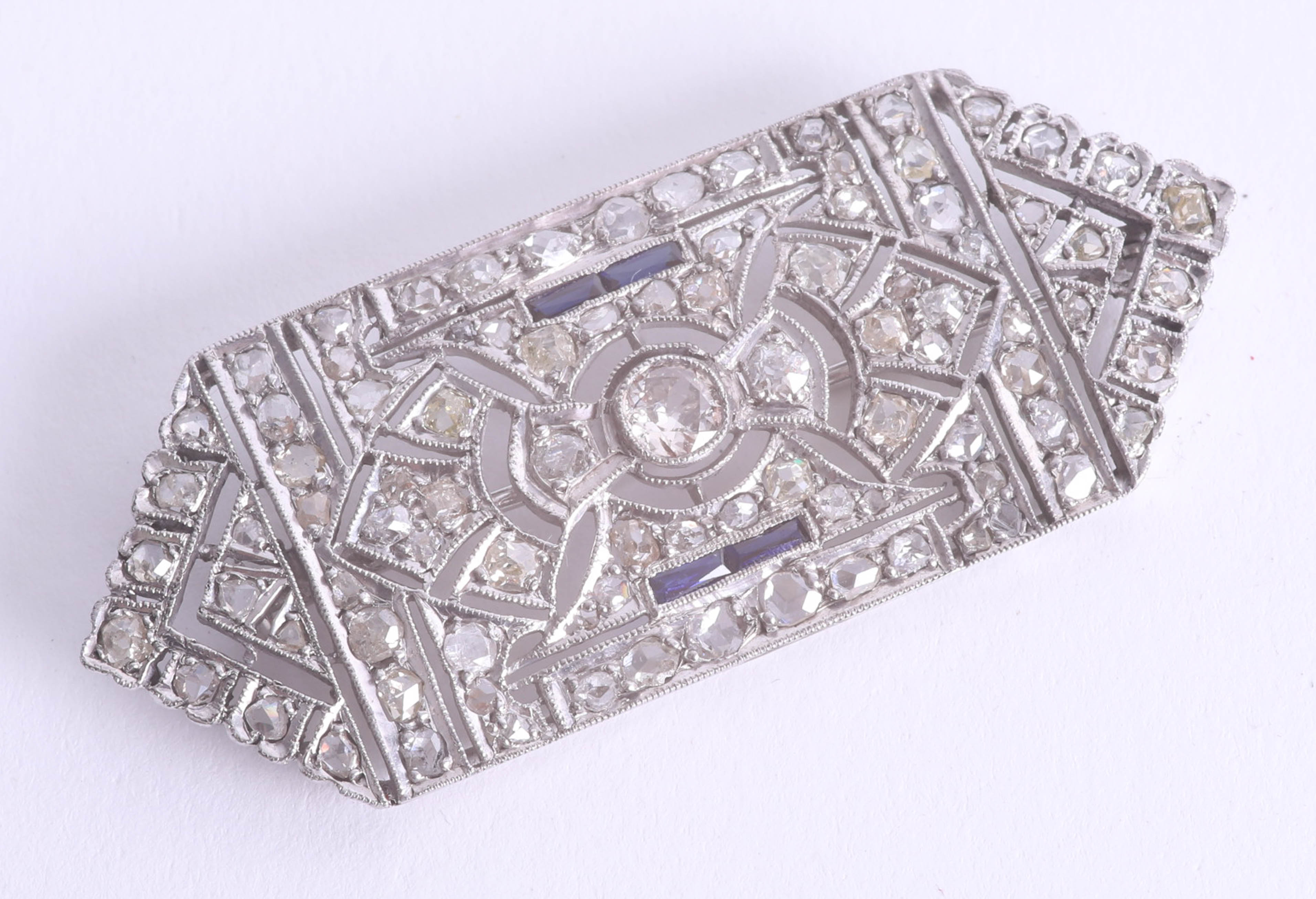 Art Deco diamond and sapphire brooch set in white gold set with eighty seven round diamonds