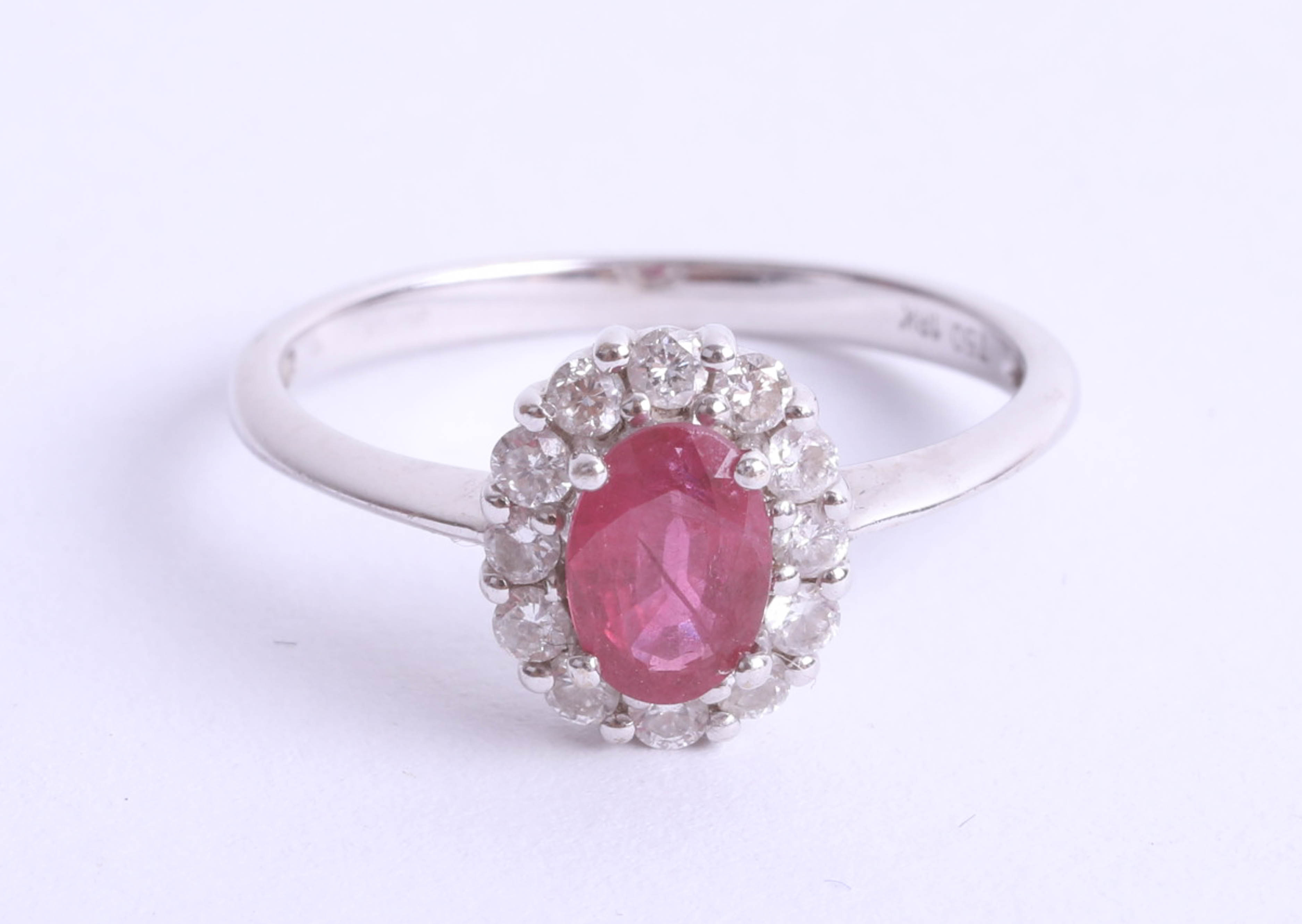 An 18ct white gold ruby cluster ring, size K.