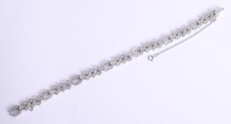 An 18ct Art Deco style diamond bracelet, approximately 22.3g, length 20cm.