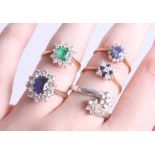 A collection of five various dress rings, including an 18ct emerald and diamond cluster ring, three