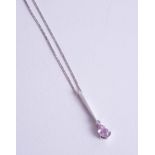 A pink sapphire and diamond set 9ct white gold pendant on a fine chain.