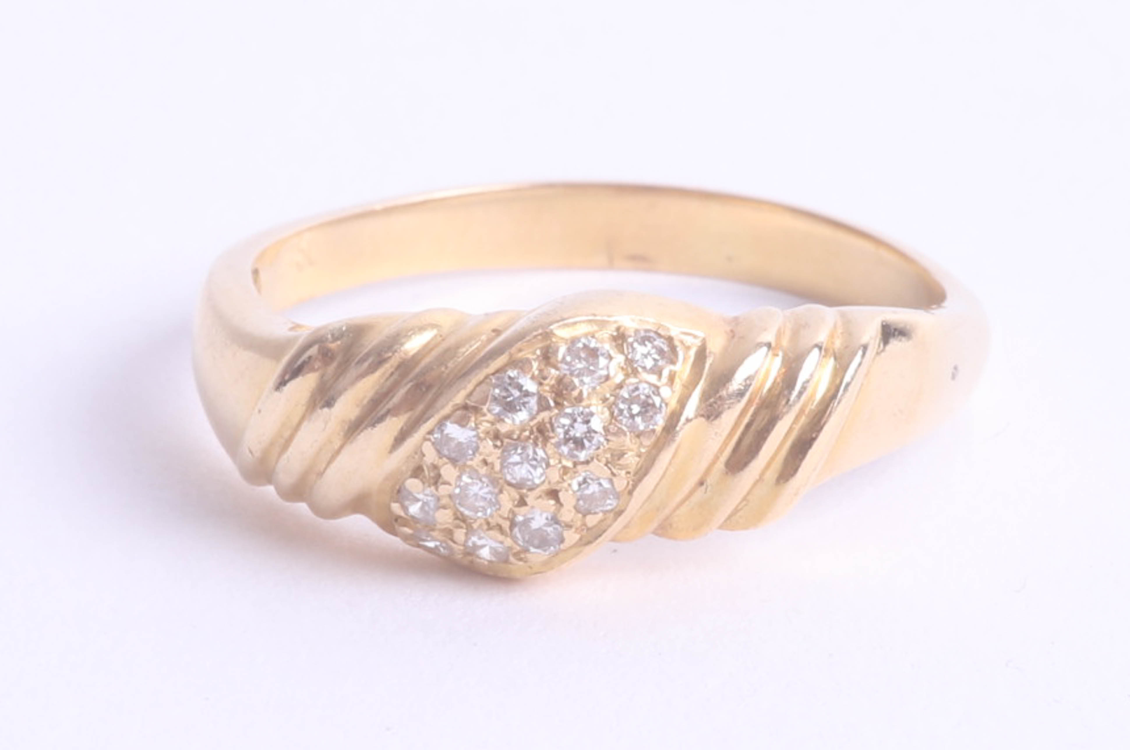 An 18ct yellow gold and diamond set fancy ring, size R.