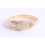 An 18ct yellow gold and diamond set fancy ring, size R.