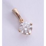 A diamond pendant set in 18ct yellow gold, approx 0.60ct, estimated colour and clarity D/SI1.