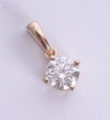 A diamond pendant set in 18ct yellow gold, approx 0.60ct, estimated colour and clarity D/SI1.