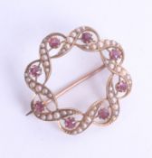 A 15ct ruby and seed pearl brooch diameter 25mm, 4.4g.