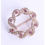 A 15ct ruby and seed pearl brooch diameter 25mm, 4.4g.