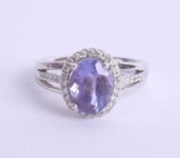 An 18ct white gold tanzanite and diamond ring, approx 2.75ct, Size N.