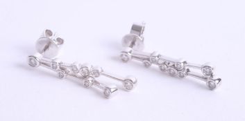 A pair 18ct diamond set drop earrings, 3.6g.