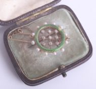 A gold, enamel, pearl and diamond set brooch, cased.