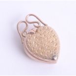 A 9ct gold heart locket, opens in three sections marked 'Patent'.
