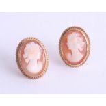 A pair of 9ct gold oval cameo earrings, each with 14mm x 10mm hand carved Italian shell,