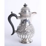 A late Victorian small coffee pot, London Circa 1894 marked GMJ with embossed and fluted decoration,