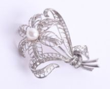 An 18ct white gold diamond set pearl brooch, approx. 60 x 50mm.