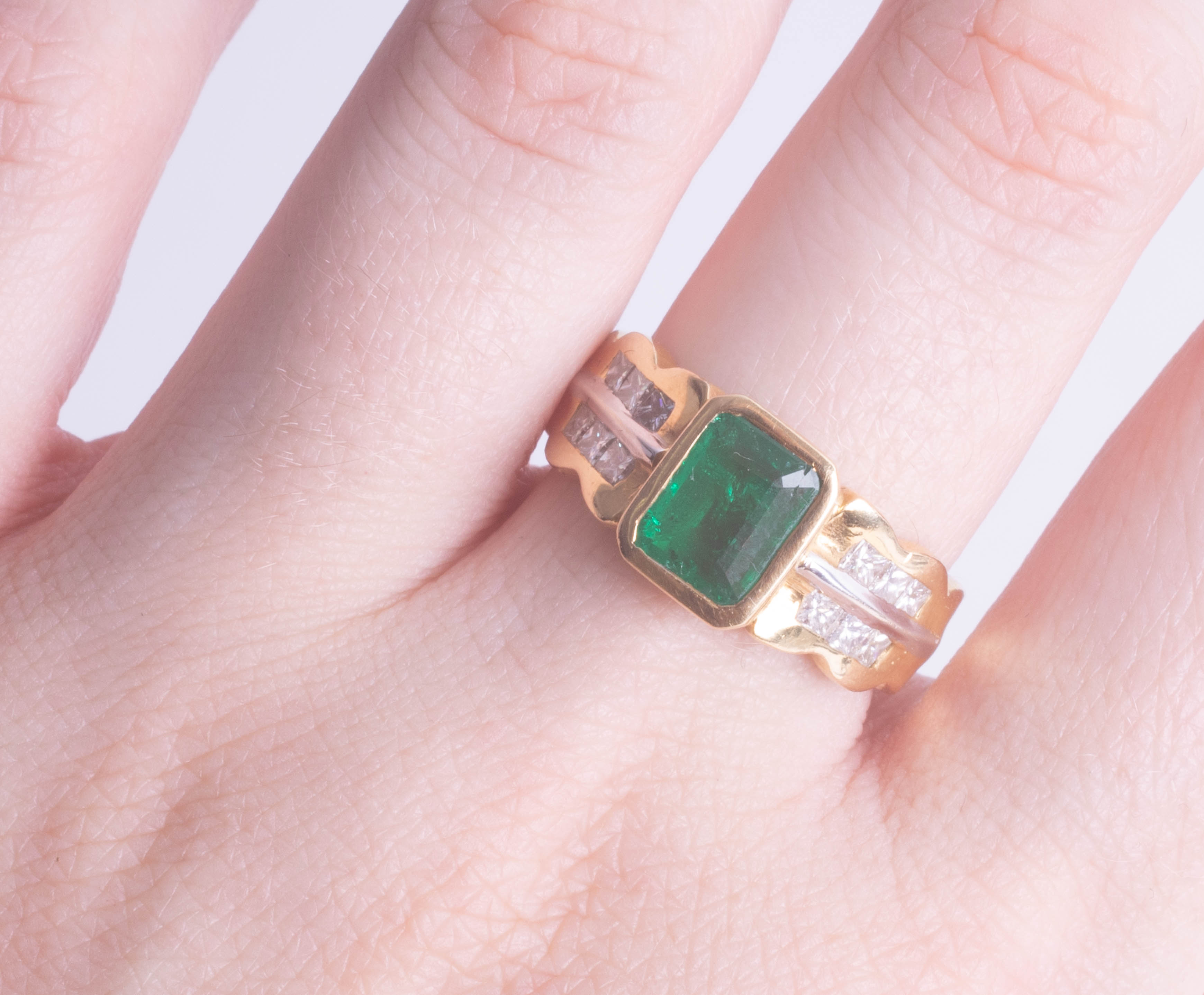 An 18ct yellow gold emerald and diamond ring, size O. - Image 2 of 3