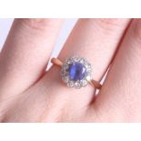 An 18ct round sapphire and diamond cluster ring, size O.