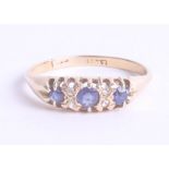 An 18ct sapphire and diamond ring, size T/U.