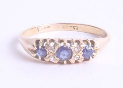 An 18ct sapphire and diamond ring, size T/U.