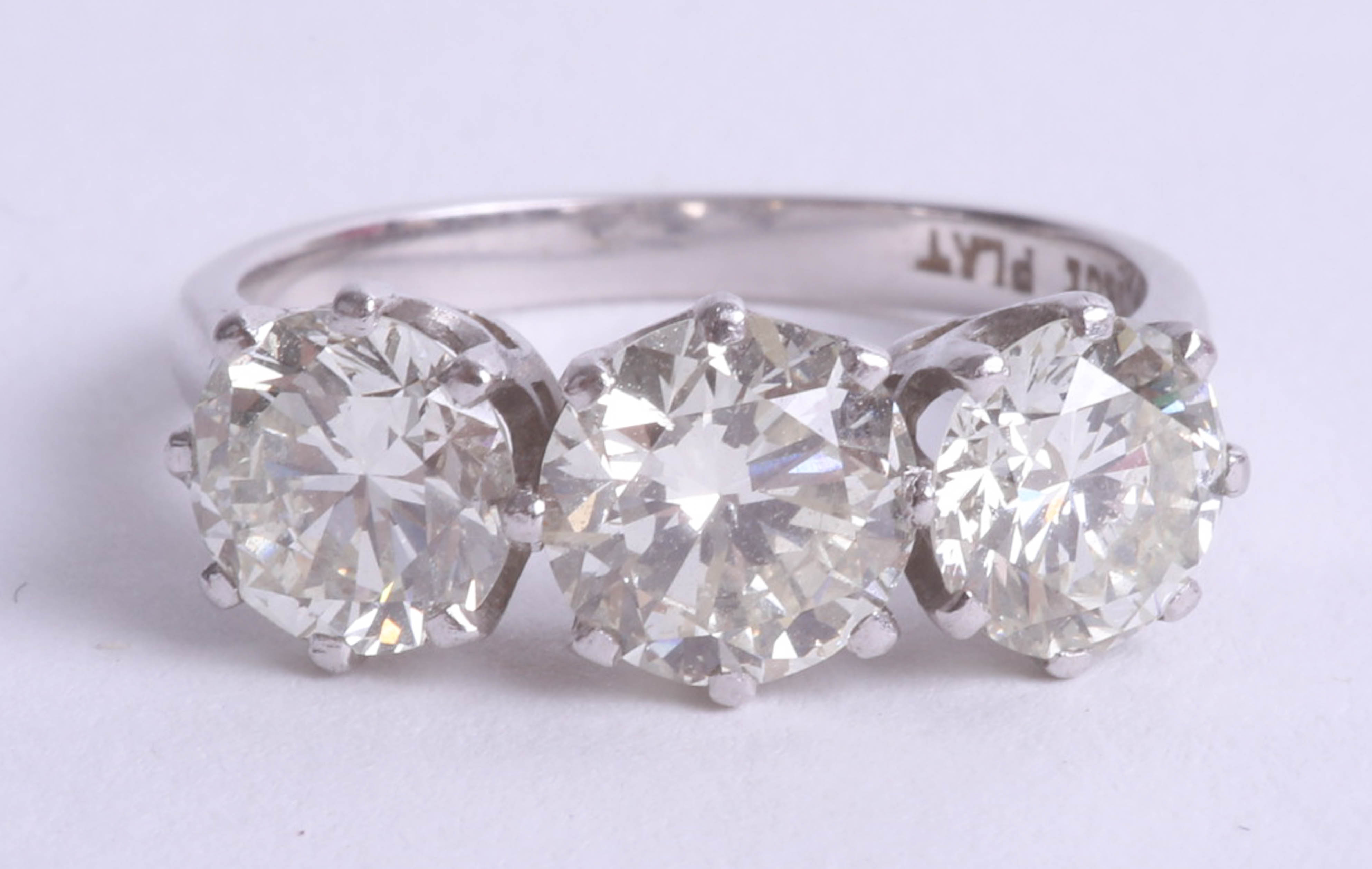 A fine diamond three stone ring, set in 18ct white gold, combined diamond weight approximately 3.