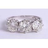 A fine diamond three stone ring, set in 18ct white gold, combined diamond weight approximately 3.