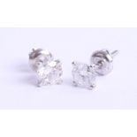 A pair of 14k white gold diamond stud earrings, with certificate, 1.03 carats, VS1, brilliant cut,