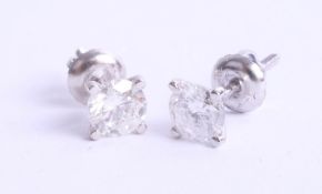A pair of 14k white gold diamond stud earrings, with certificate, 1.03 carats, VS1, brilliant cut,