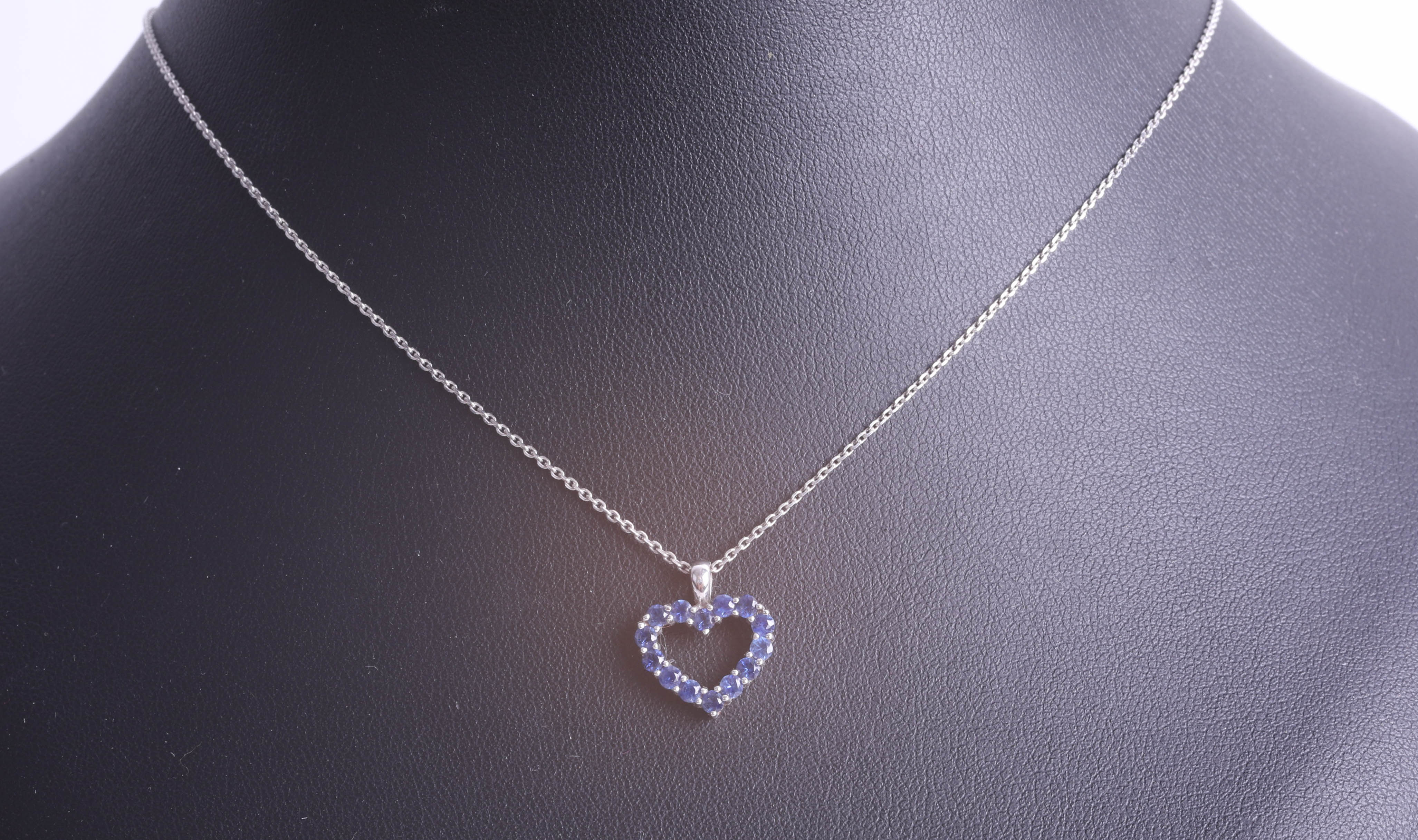 An 18ct white gold heart-shaped pendant, set with blue stone (sapphire?) on a fine chain. - Image 2 of 2