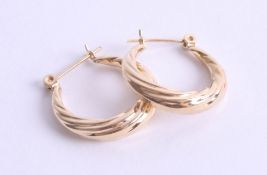 A pair of unmarked gold earrings (purchased as 14k) 2.1g.