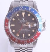 Rolex, a gents stainless steel Oyster Perpetual GMT Master chronometer, pepsi dial, box and