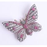 An impressive antique ruby, diamond and emerald butterfly brooch, approx. 53mm wing span set in