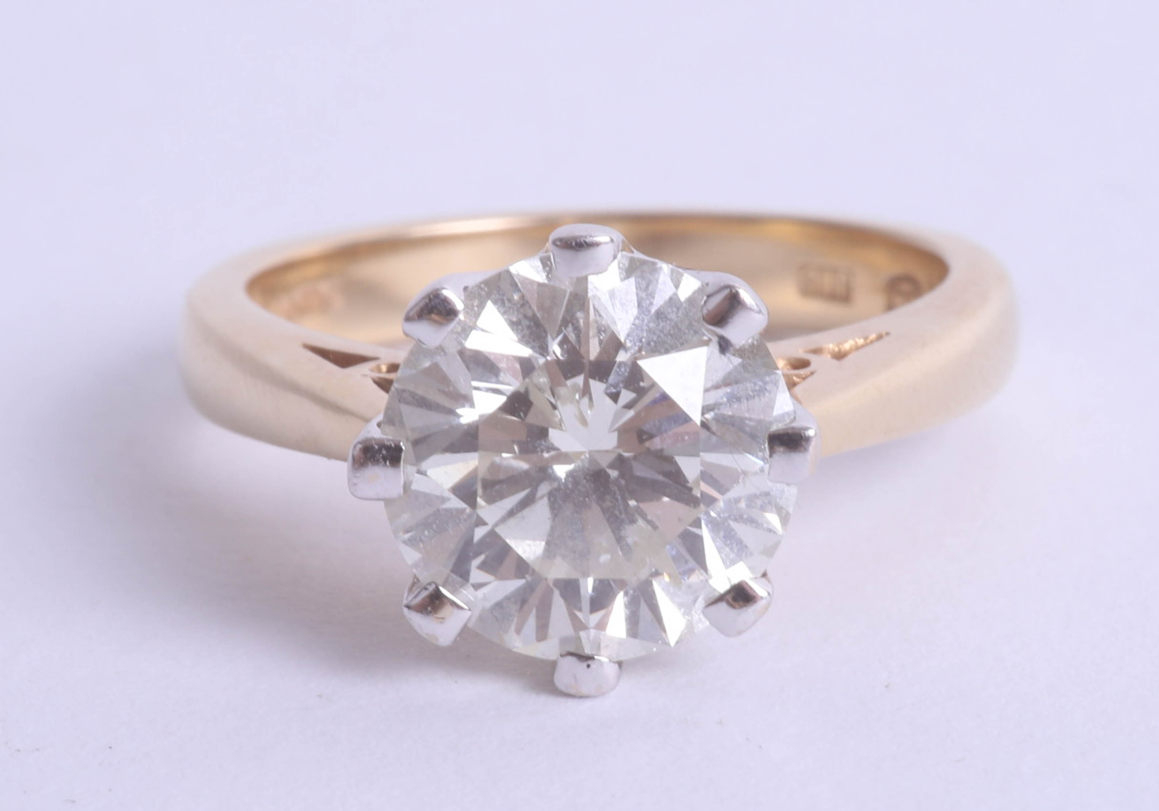 A large diamond solitaire ring, set in yellow gold, approx 3.00 carats, ring size N, judged to be