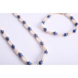 A pearl and lapis lazuli necklace and matching bracelet, length of necklace 52cm, set with gold