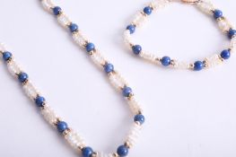 A pearl and lapis lazuli necklace and matching bracelet, length of necklace 52cm, set with gold