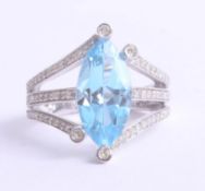 A large 9ct diamond and topaz set dress ring, size O, 5.4g.